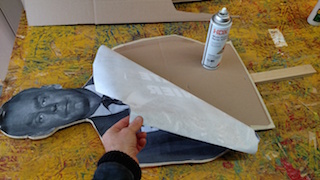 spray adhesive ready to glue paper to cardboard